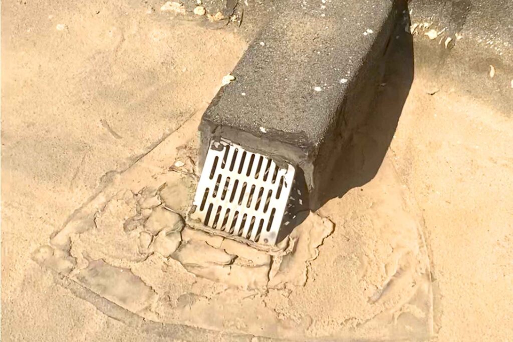 Failed roof drainage outlet at Omar Bin Al Khattab Mosque in Hatta Dubai causing water ponding and recurring roof leakage issues.