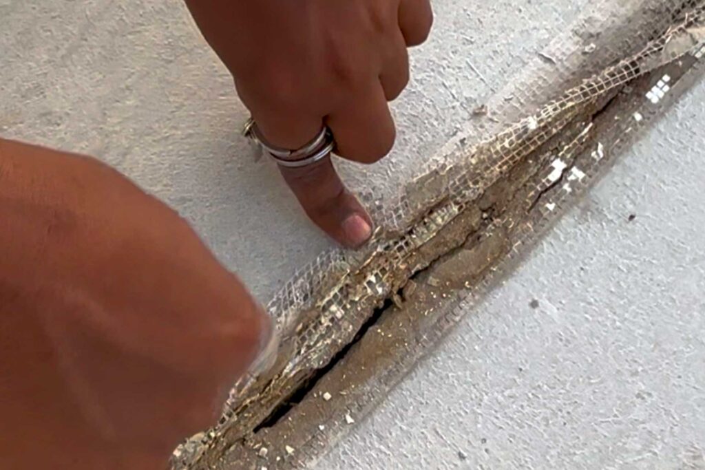 Damaged waterproofing joint and cracked roof detail identified during engineering investigation at Omar Bin Al Khattab Mosque in Dubai.