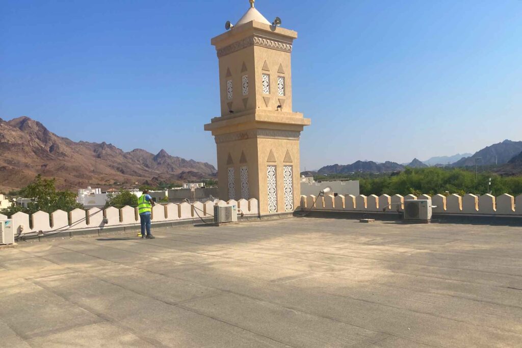 Omar Bin Al Khattab Mosque rooftop waterproofing inspection in Hatta Dubai showing roof drainage and waterproofing assessment area before restoration works.