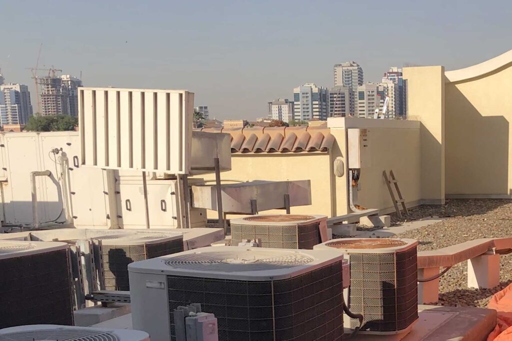 Roof drainage inspection during villa waterproofing investigation in Dubai identifying defective waterproofing and rainwater discharge areas.